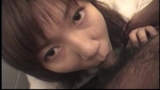 Aroused Asian babe sucks on the sausage
