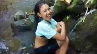 Indo malay bathing at a river